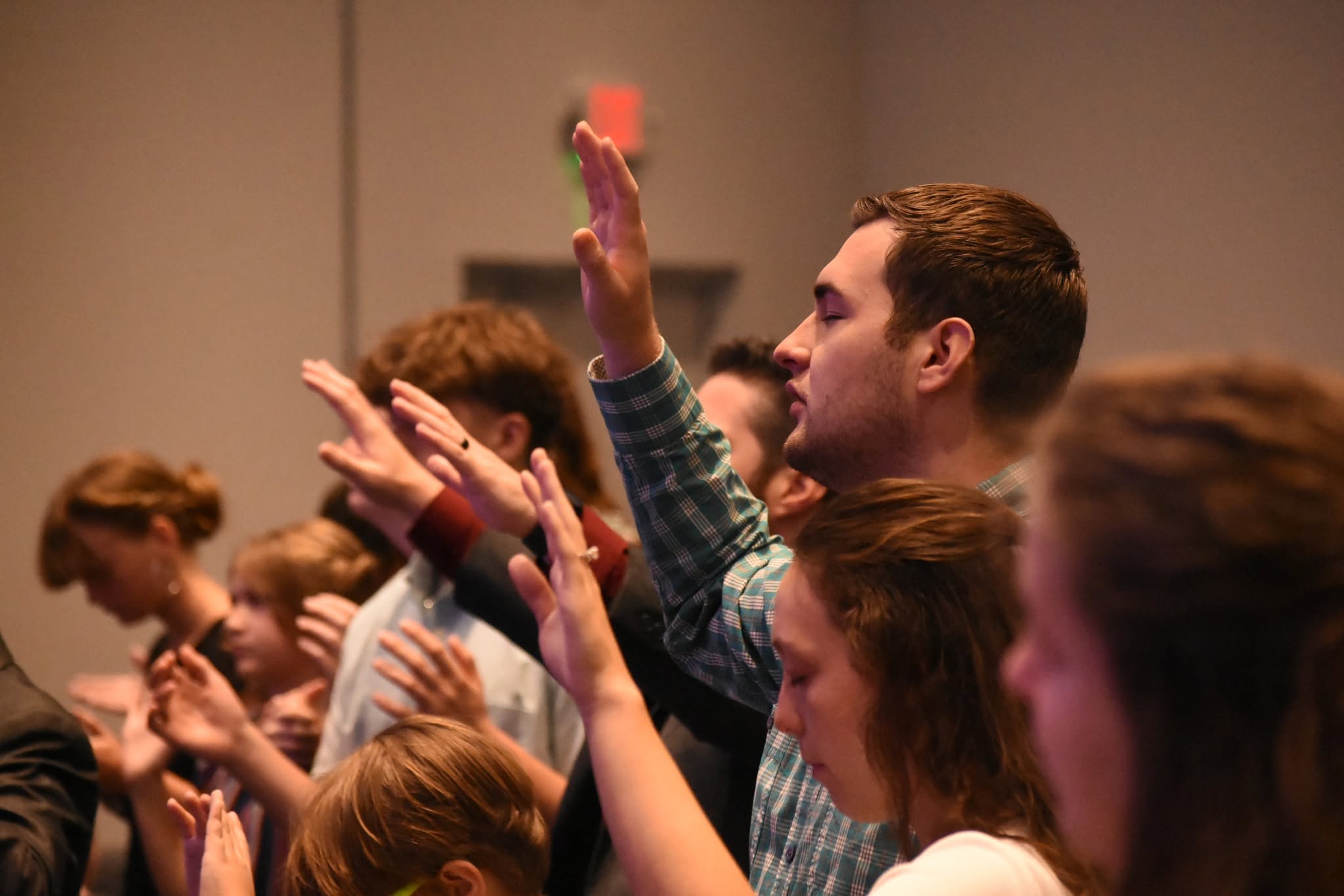 Congregants worshipping together at Apostolic Lighthouse Church